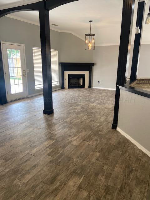 8101 Sheldon Road Amarillo, TX 79119 - Photo 3 of 20 a view of an empty room with wooden floor fireplace and a window