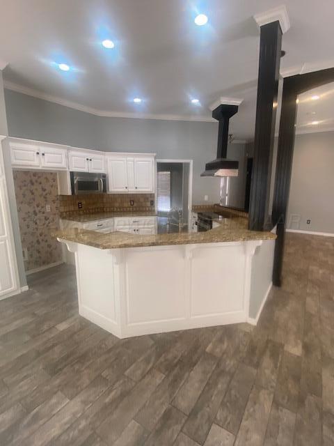8101 Sheldon Road Amarillo, TX 79119 - Photo 6 of 12 a large kitchen with kitchen island granite countertop a sink counter top space appliances and cabinets