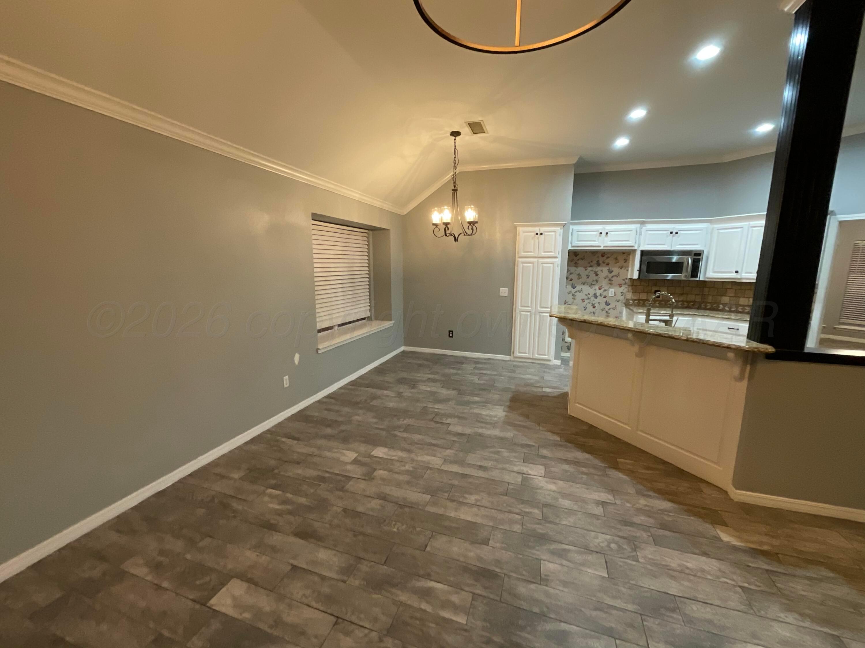 8101 Sheldon Road Amarillo, TX 79119 - Photo 7 of 20 a view of a kitchen with a sink and cabinets