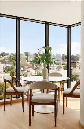 a view of a floor to ceiling window and wooden floor