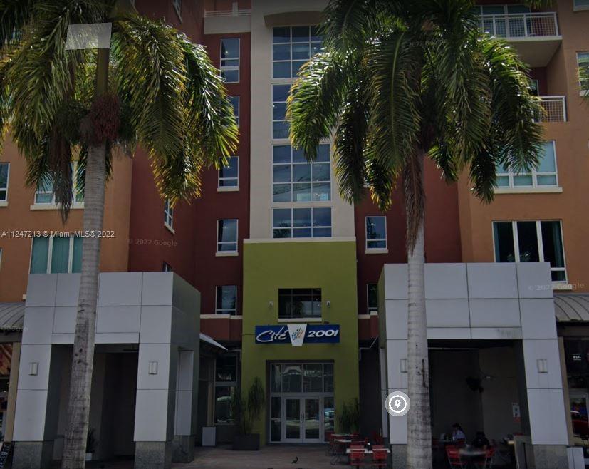 2001 Biscayne Boulevard, Unit 2414 Miami, FL 33137 - Photo 1 of 8 a front view of a house with plants and palm trees