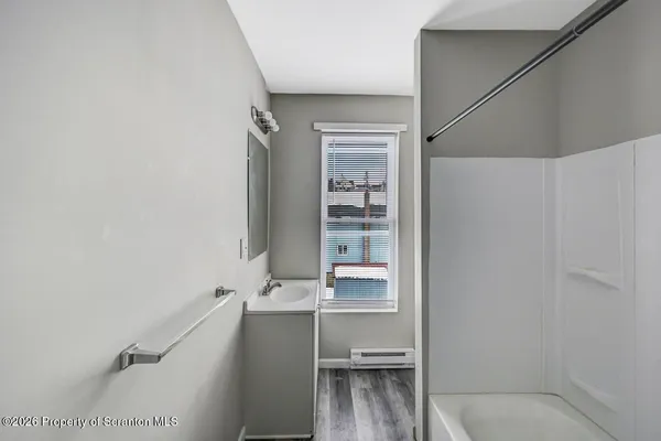 a bathroom with a sink and a large mirror