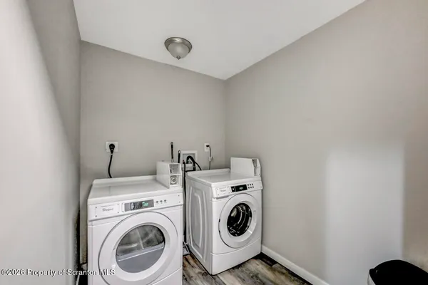 a view of entryway with wooden walls