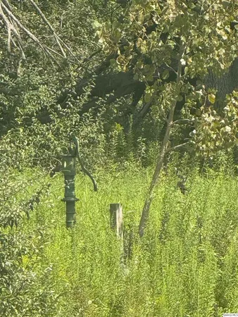 a view of a lake with houses in the back