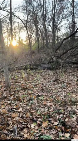 a sign that is sitting on a brick wall