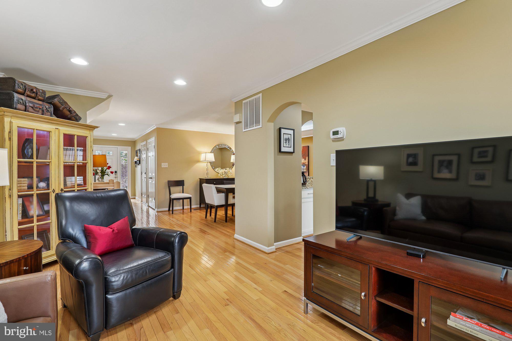 8019 Galla Knoll Circle Springfield, VA 22153 - Photo 7 of 57 a living room with furniture and a flat screen tv