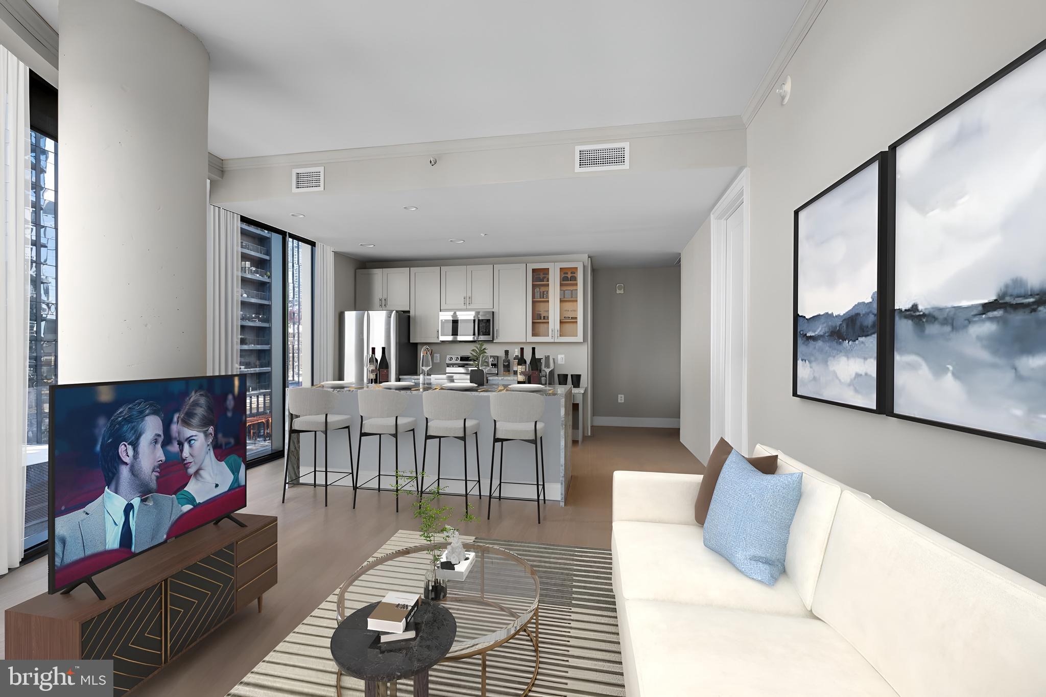 2301-61 John F Kennedy Boulevard, Unit 1313 Philadelphia, PA 19103 - Photo 3 of 42 a living room with furniture and wooden floor