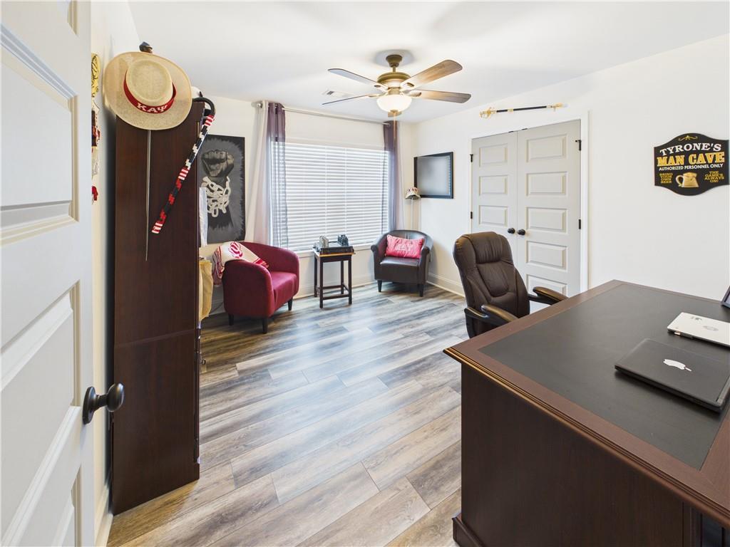 52 Owens Road Fort Mitchell, AL 36856 - Photo 21 of 29 Spacious room featuring wood-finish flooring and a ceiling fan with integrated lighting