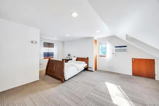 a bed room with a bed and a window