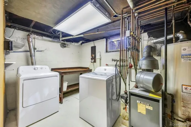 a backyard of a house with barbeque oven table and chairs