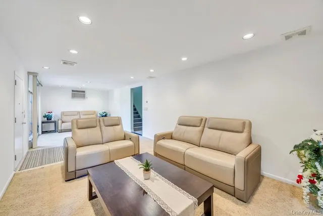 a living room with furniture and a couch