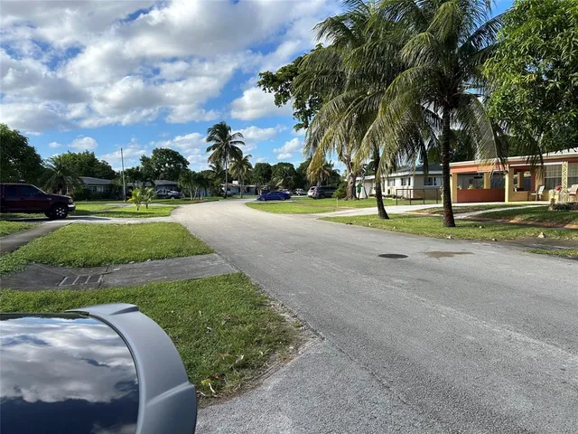 a view of a park with swings and slides