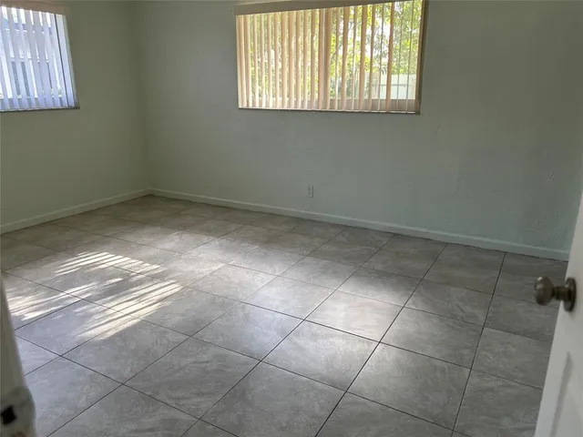 a view of a room that has a window in it