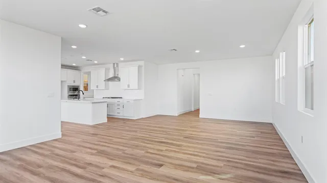 a view of kitchen with wooden floor