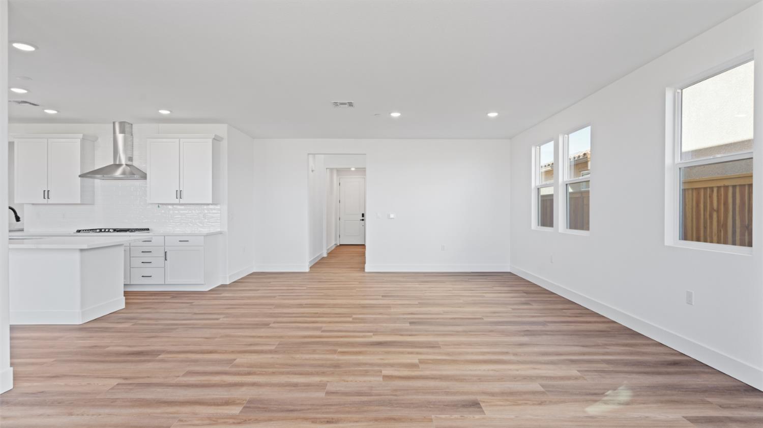 775 Lorca Street Mountain House, CA 95391 - Photo 13 of 41 a view of a kitchen with wooden floor and electronic appliances