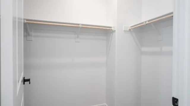 a bathroom with a double vanity sink mirror and shower