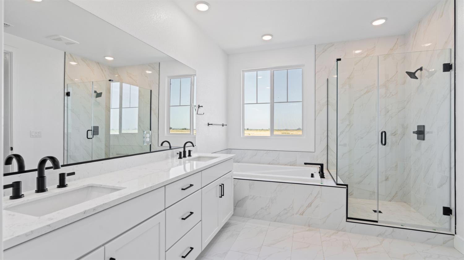 775 Lorca Street Mountain House, CA 95391 - Photo 37 of 41 a bathroom with a double vanity sink mirror and shower