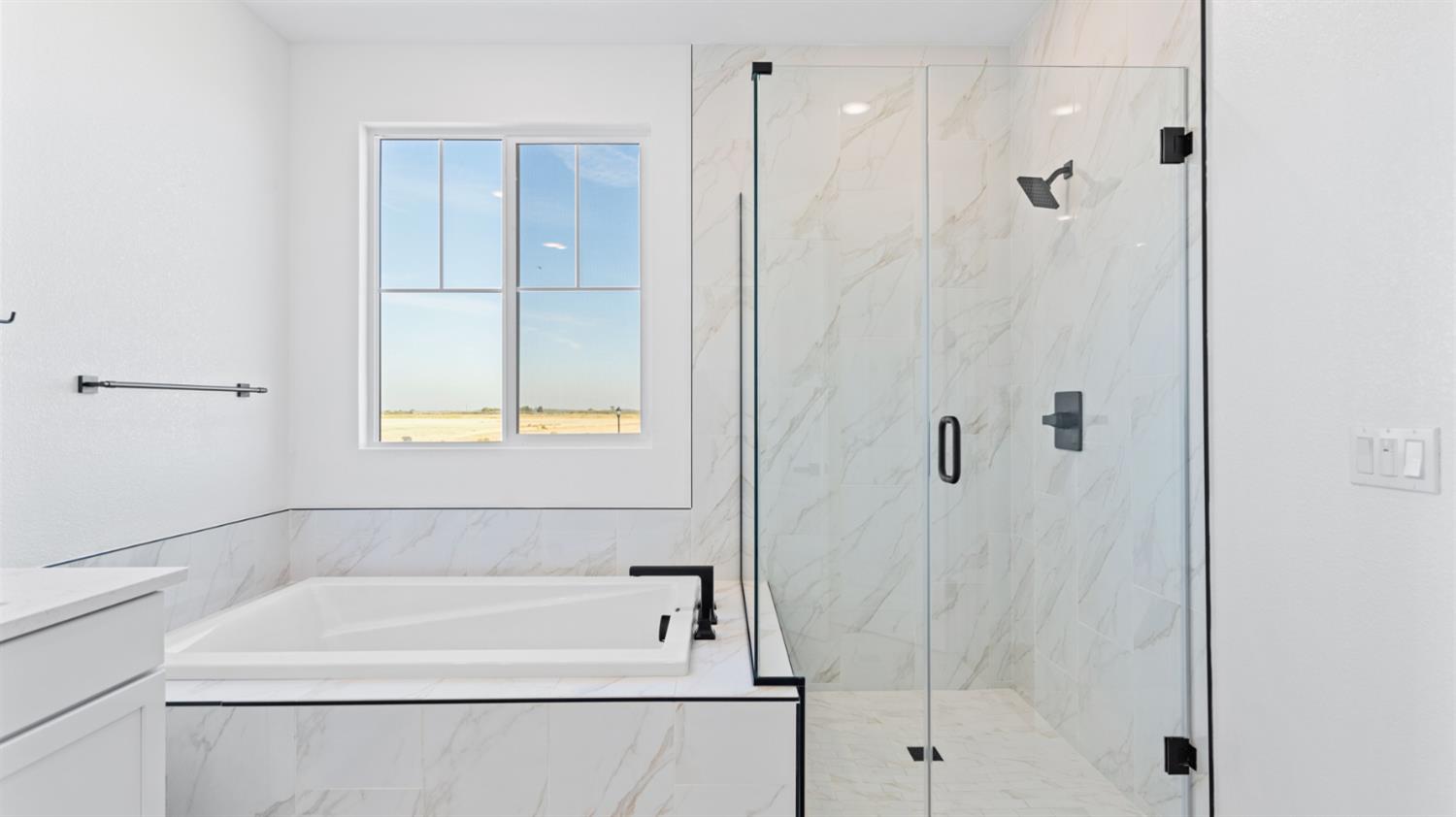 775 Lorca Street Mountain House, CA 95391 - Photo 38 of 41 a bathroom with a bathtub and a shower