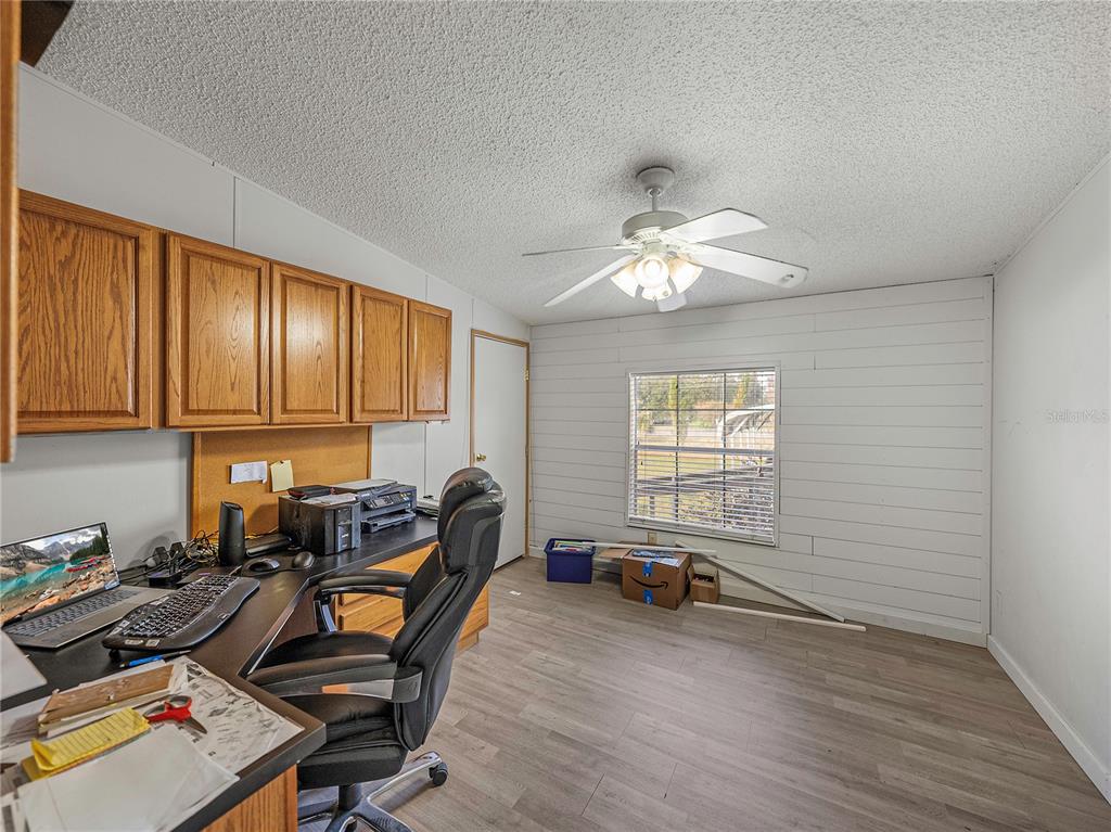 11404 Lithia Pinecrest Road Lithia, FL 33547 - Photo 23 of 63 a room with gym equipment and window