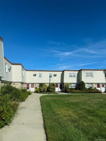 a view of a car is parked in front of a building