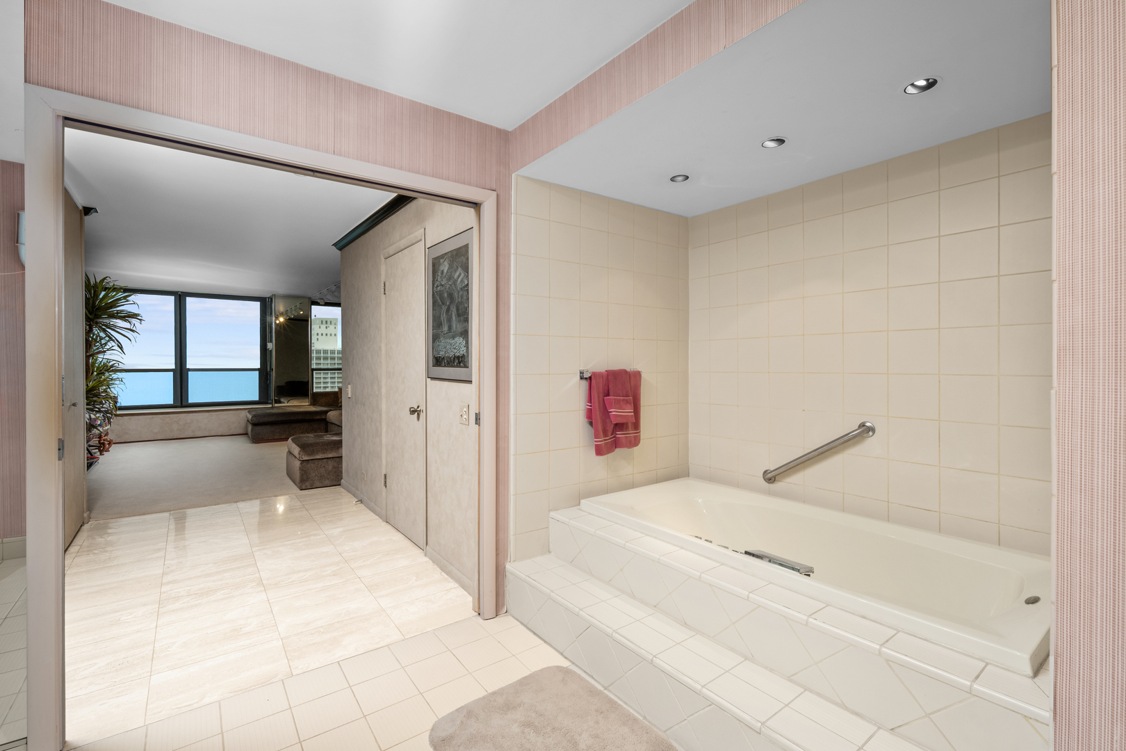 1030 North State Street, Unit 51EF Chicago, IL 60610 - Photo 14 of 20 a bathroom with a tub shower and mirror