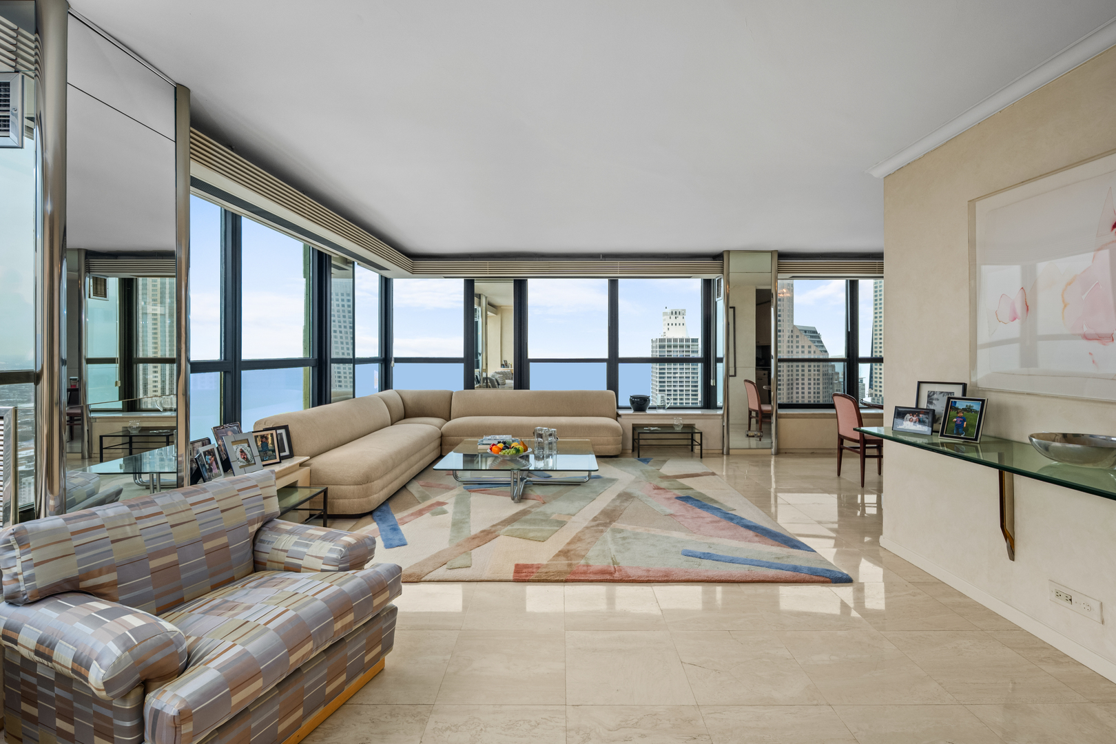 1030 North State Street, Unit 51EF Chicago, IL 60610 - Photo 3 of 20 a living room with furniture and a large window