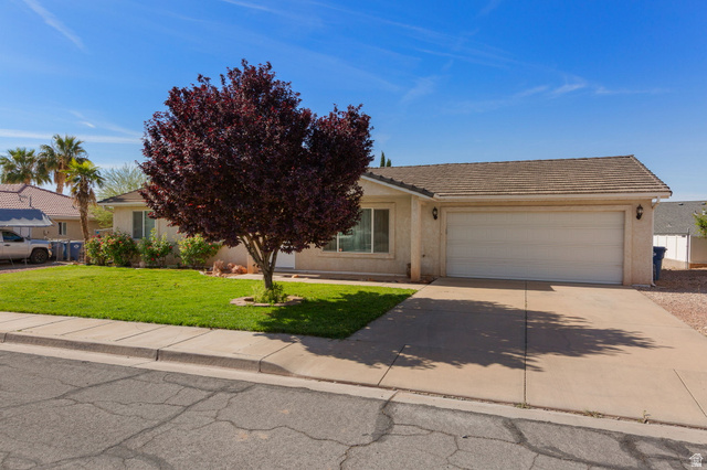 664 East Springhill Drive Washington, UT 84780 - Photo 1 of 21 Single-story stucco residence featuring an attached garage with a concrete driveway