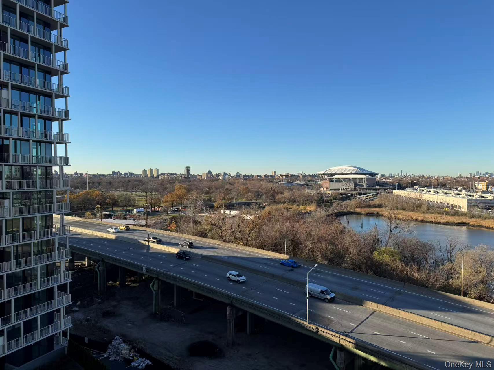 131-02 40th Road, Unit 10F Queens, NY 11354 - Photo 15 of 15 a view of a lake with tall buildings