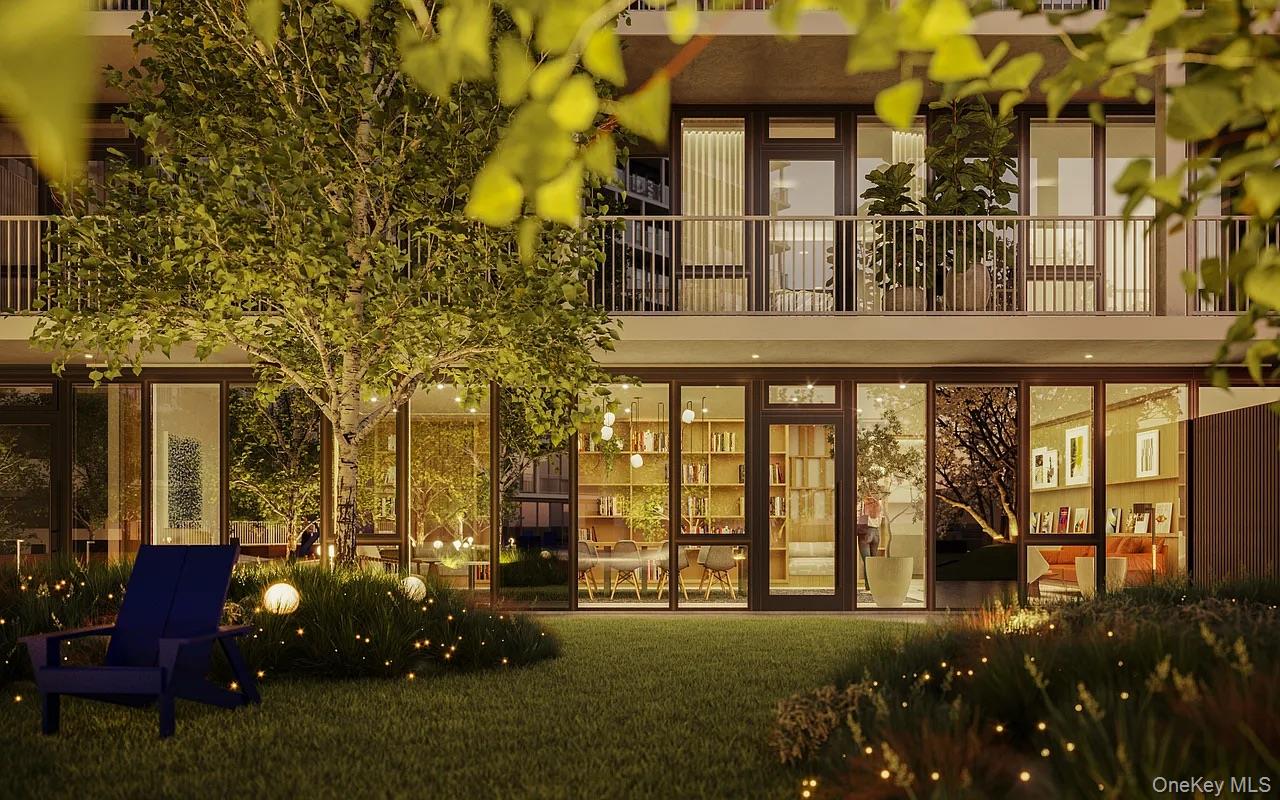 131-02 40th Road, Unit 10F Queens, NY 11354 - Photo 4 of 15 a front view of a building with a garden