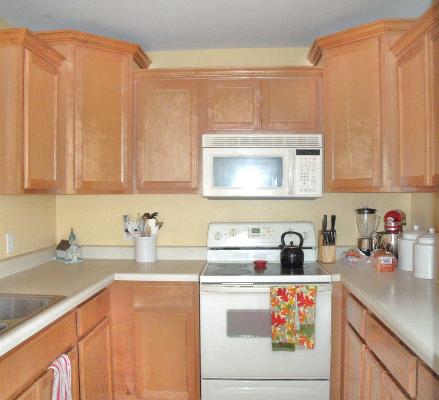 227 West Cortland Center Road Cortland, IL 60112 - Photo 4 of 10 a kitchen with stainless steel appliances granite countertop a sink a stove and cabinets