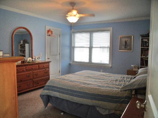 227 West Cortland Center Road Cortland, IL 60112 - Photo 7 of 10 a bedroom with a bed and a dresser