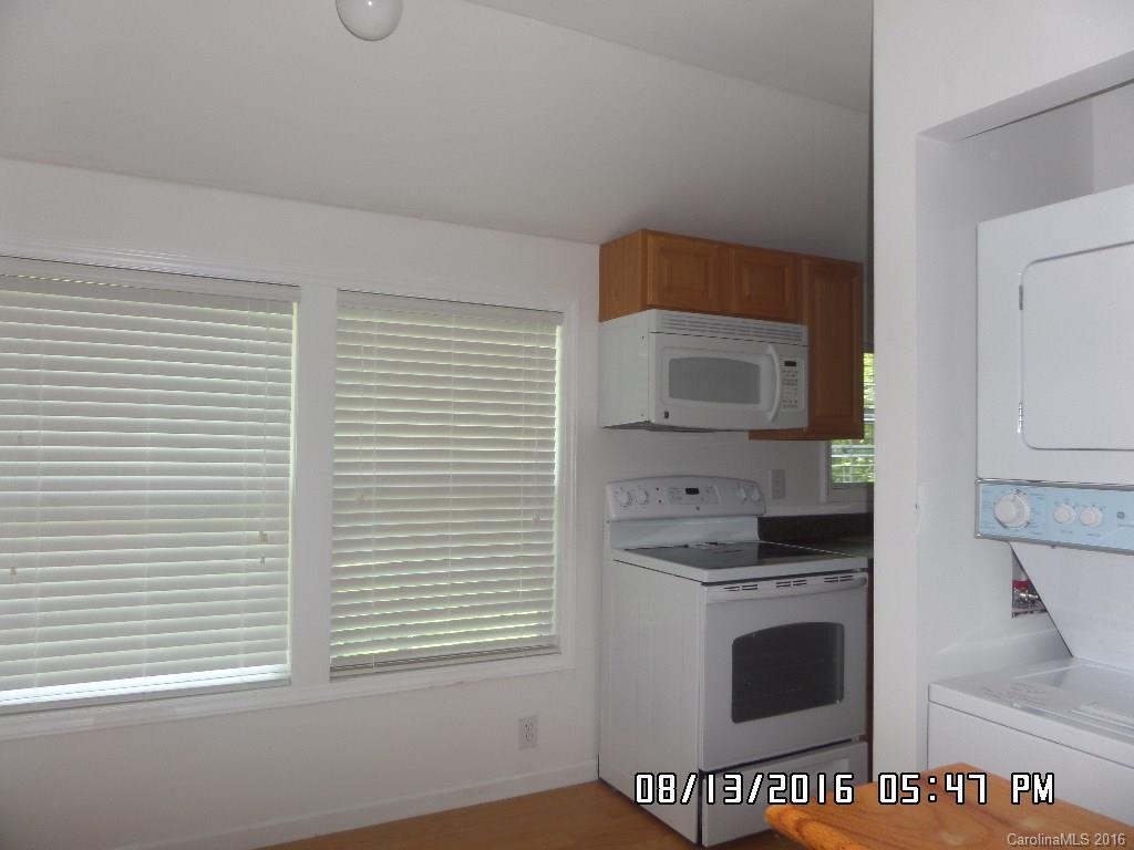 159 Pine Street Rutherfordton, NC 28139 - Photo 15 of 23 a kitchen with a stove and a microwave
