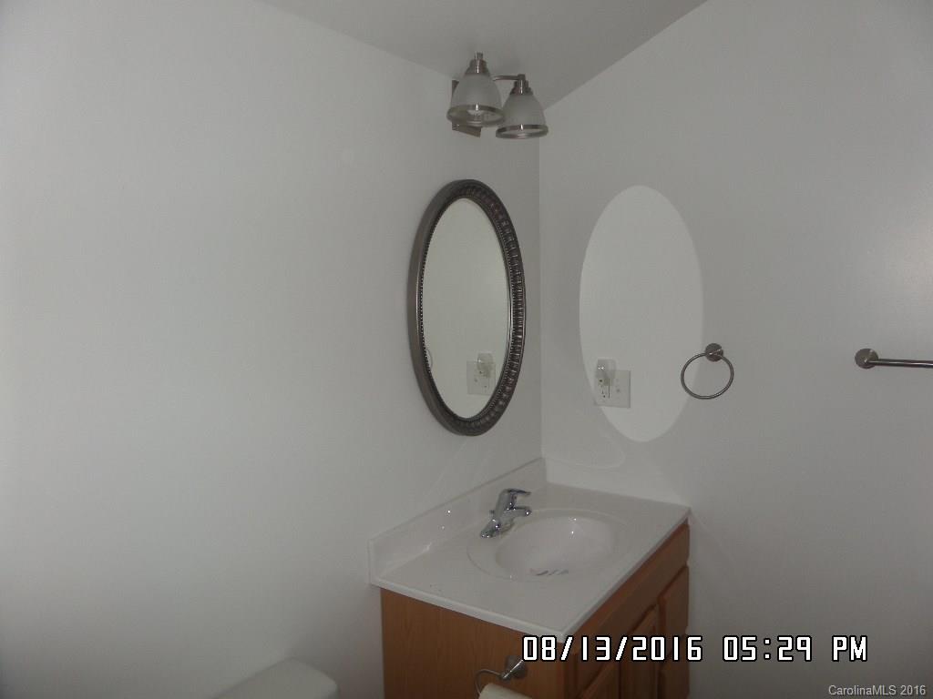 159 Pine Street Rutherfordton, NC 28139 - Photo 16 of 23 a bathroom with a sink and a mirror