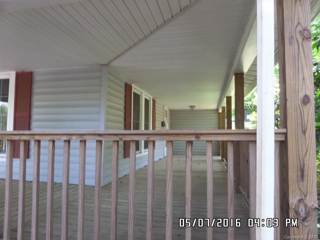 159 Pine Street Rutherfordton, NC 28139 - Photo 5 of 23 a view of a black and white wooden door