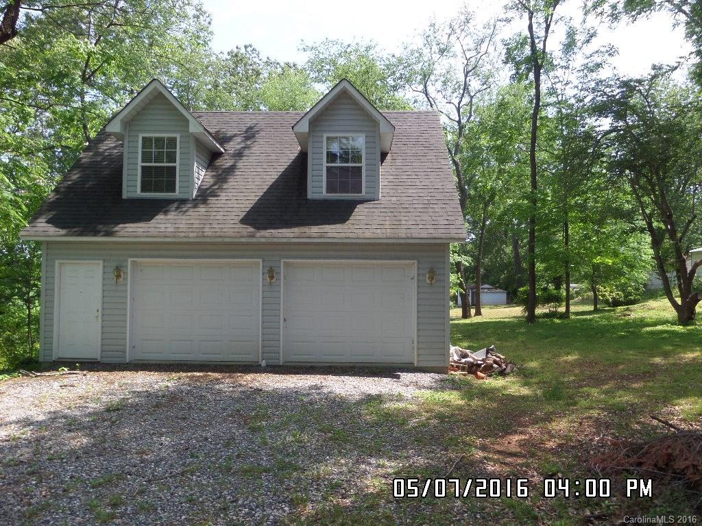 159 Pine Street Rutherfordton, NC 28139 - Photo 7 of 23 a front view of a house with a garden