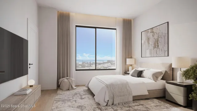 a bedroom with a large bed and a window