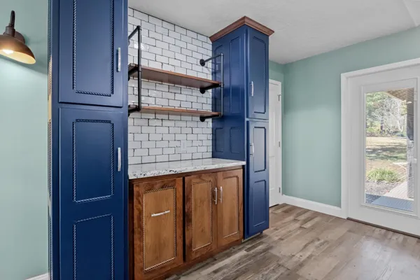 a stove top oven sitting inside of a kitchen