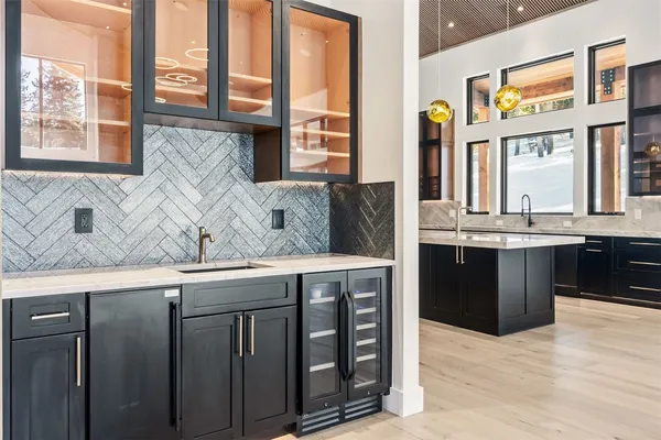 a kitchen with a sink and large window