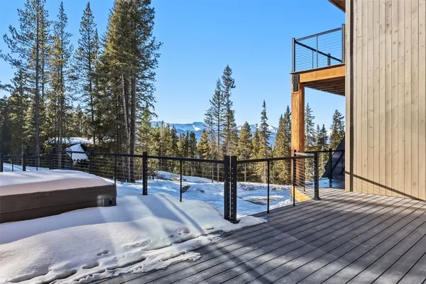 a view of a balcony with wooden floor
