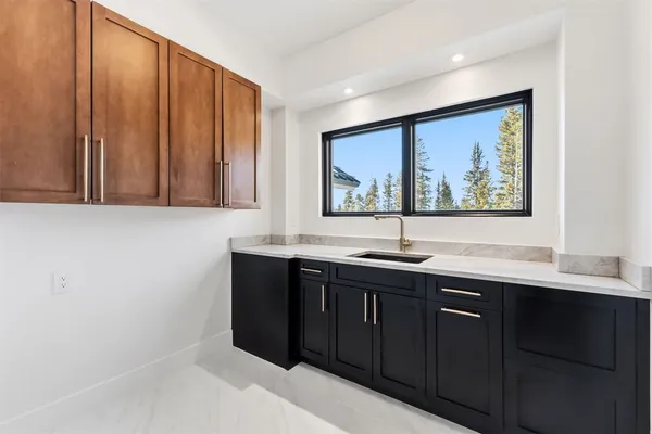 a kitchen with a sink and cabinets