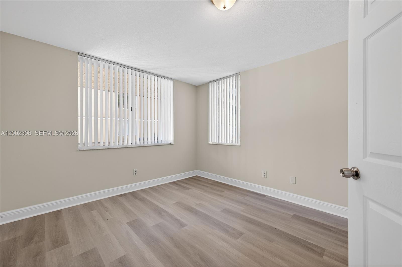 4025 West McNab Road, Unit E109 Pompano Beach, FL 33069 - Photo 12 of 27 an empty room with a window