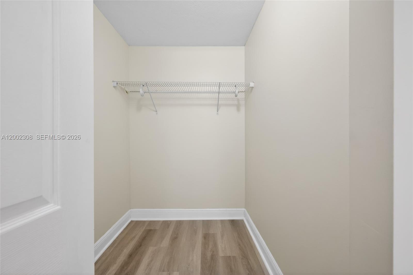 4025 West McNab Road, Unit E109 Pompano Beach, FL 33069 - Photo 14 of 27 a view of a room with wooden floor