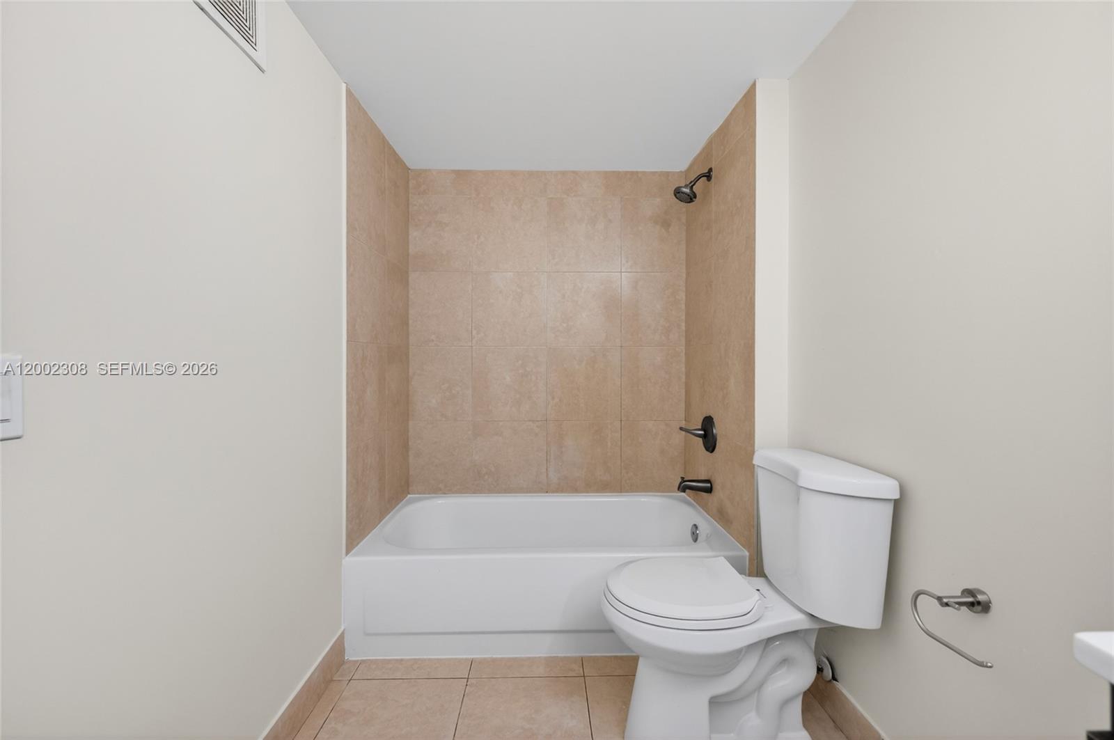 4025 West McNab Road, Unit E109 Pompano Beach, FL 33069 - Photo 16 of 27 a bathroom with a toilet and a bathtub
