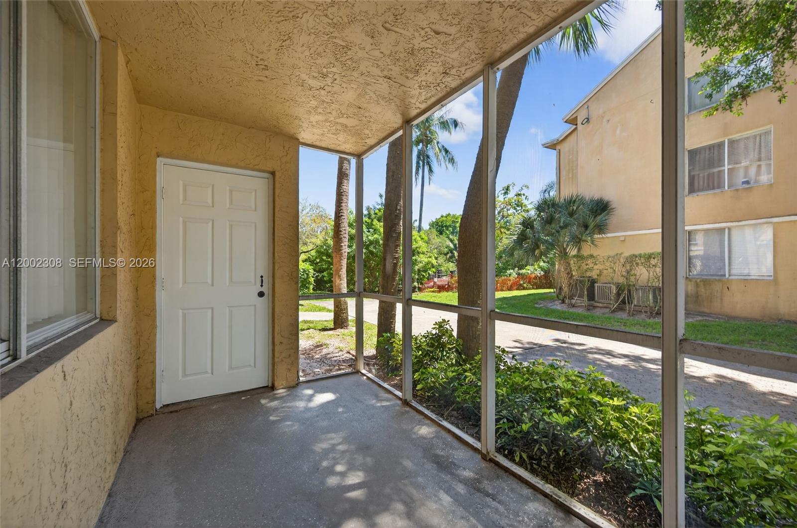 4025 West McNab Road, Unit E109 Pompano Beach, FL 33069 - Photo 18 of 27 a view of a house with a porch