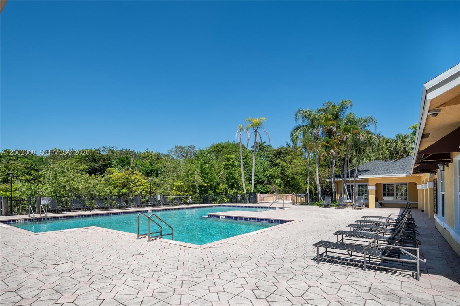 4025 West McNab Road, Unit E109 Pompano Beach, FL 33069 - Photo 25 of 27 a view of swimming pool with a patio