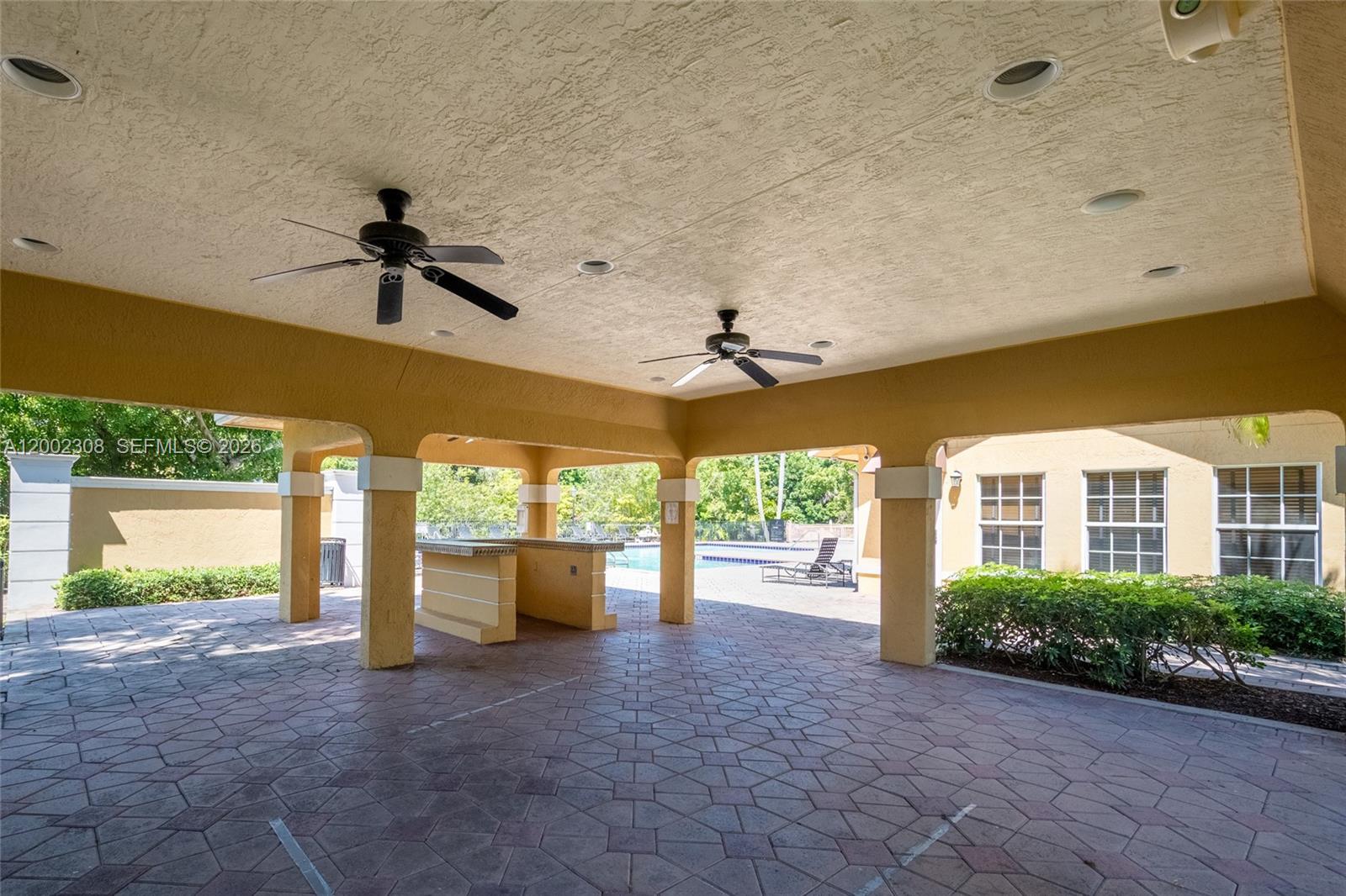4025 West McNab Road, Unit E109 Pompano Beach, FL 33069 - Photo 27 of 27 a view of a porch with a backyard