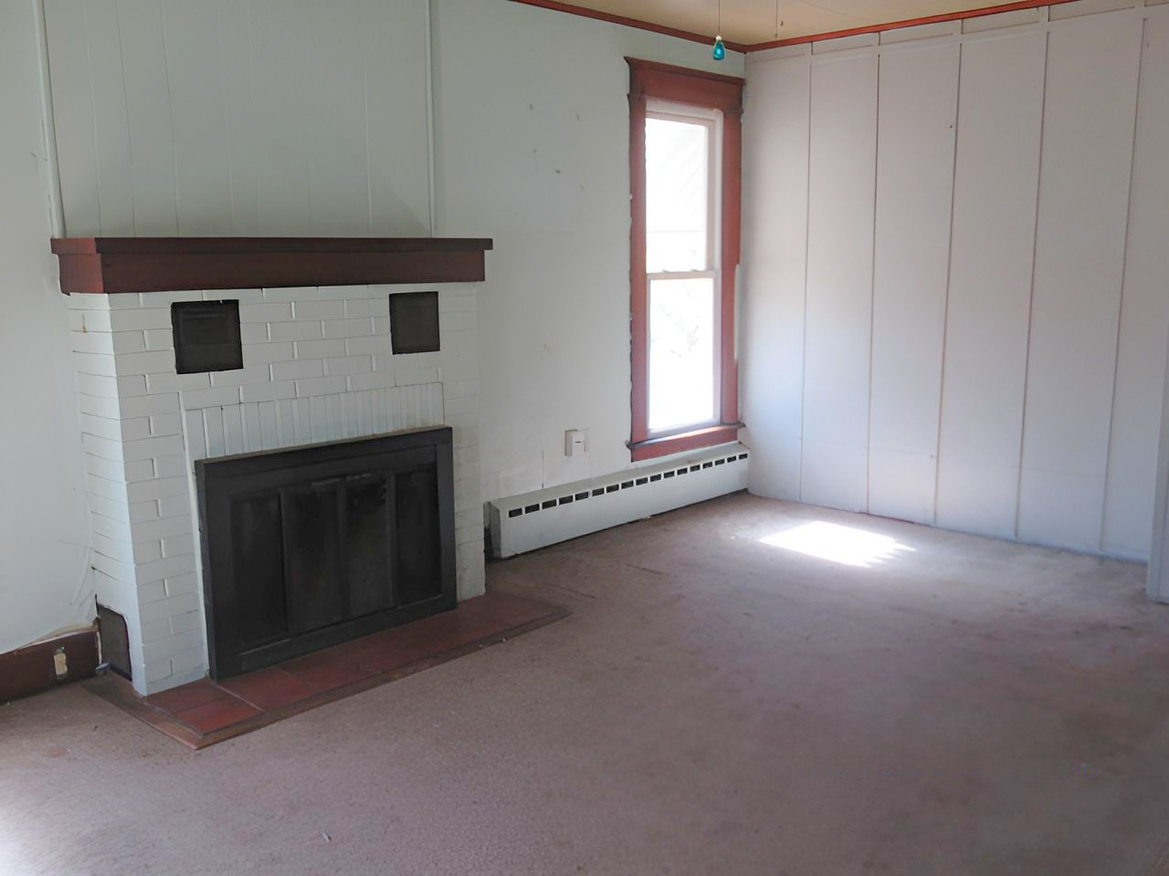 504 South Seminary Street Georgetown, IL 61846 - Photo 22 of 28 a view of empty room with a fireplace