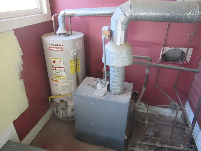 a bed room with a bed and a lamp