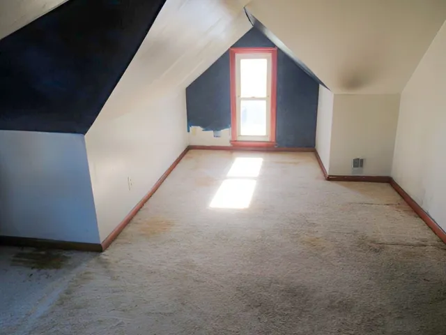 a view of empty room with windows