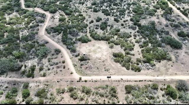 an aerial view of a yard with a space